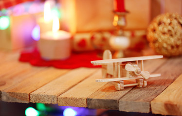 Wooden plane on the decorated table, close up