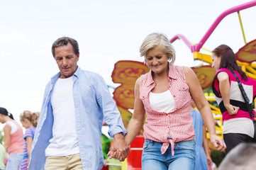 Senior couple in amusement park