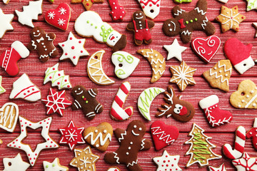 Christmas cookies on a red wooden table