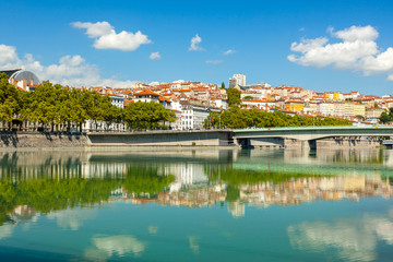 Fototapeta na wymiar Cityscape of Lyon, France with reflections in the water