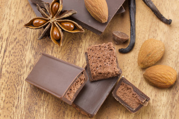 Chocolate bars on wooden background 
