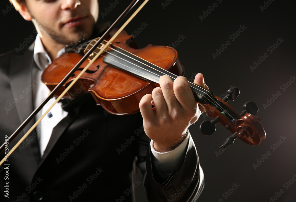 Canvas Prints violinist's performance on black background, close up