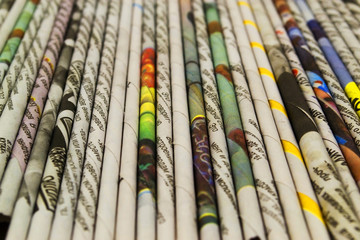 Straws of colored newsprint
