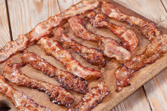 bacon on a wooden plate