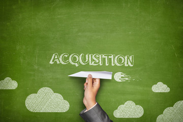 Acquisition concept on blackboard with paper plane