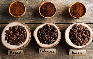 Collection of coffee beans on old wooden table, close up