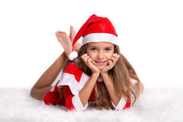 Cute smiling girl with Santa hat and suit