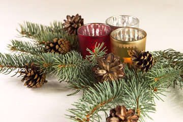 candels and christmas tree on the white background