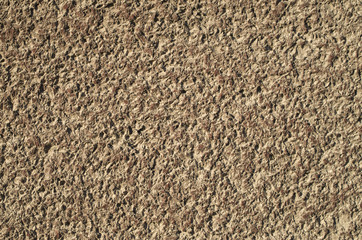 Brown decorative relief plaster on wall
