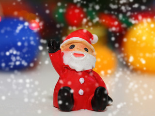 Christmas background, close up of Santa clause on snow and bokeh