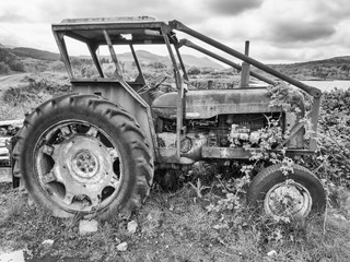 Fototapeta na wymiar Salen Pier, Isle of Mull, Scotland. 22nd May 2015. The old derelict tractor.