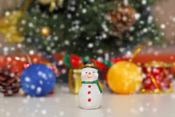 snow man on snow and bokeh background, Christmas background