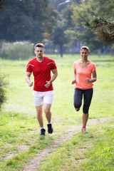 Fototapeta premium Young people running in the park
