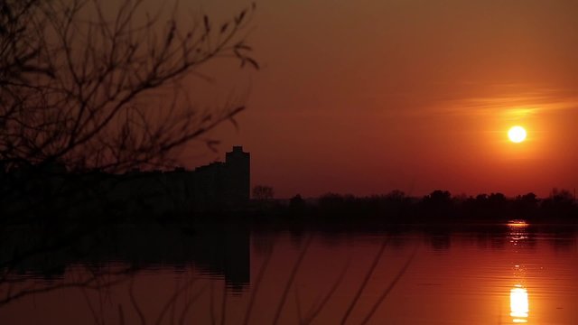 Evening, river, sunset, patch of yellow sunlight
