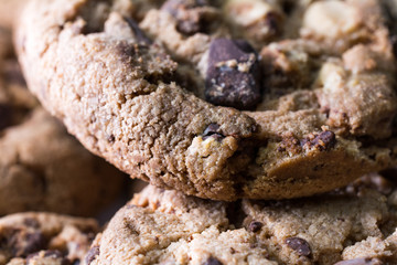 Extreme Macro Of A Baked Cookie With A Big Chocolate Chip On Top, Lying On Other Biscuits