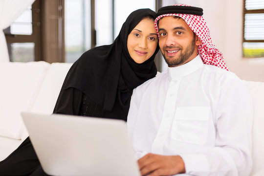 Muslim Couple Using Laptop Computer