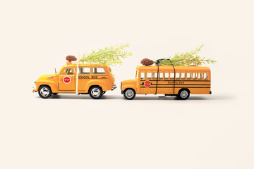 School buses toy model and Christmas tree.Christmas background w