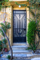 Fototapeta na wymiar Entrance to an old building in Plaka neighbprhood, Athens, Greece