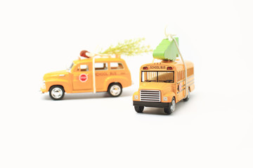School buses toy model and Christmas tree.Christmas background with Copyspace for text .