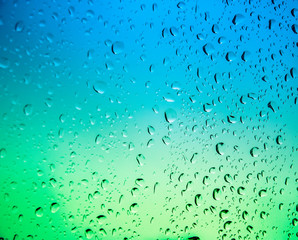 Green background with water bubbles or Raindrops.