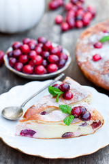 pieces  of cranberry cheesecake tart on a wooden table