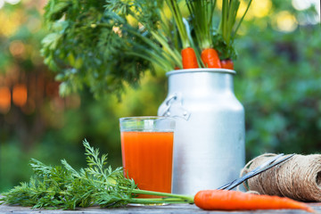 Carrot juice on wooden background