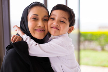 muslim boy hugging his mother - 97152411