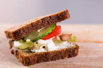 Cooking fresh homemade grilled tuna sandwich on wood