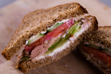 Cooking fresh homemade grilled tuna sandwich on wood