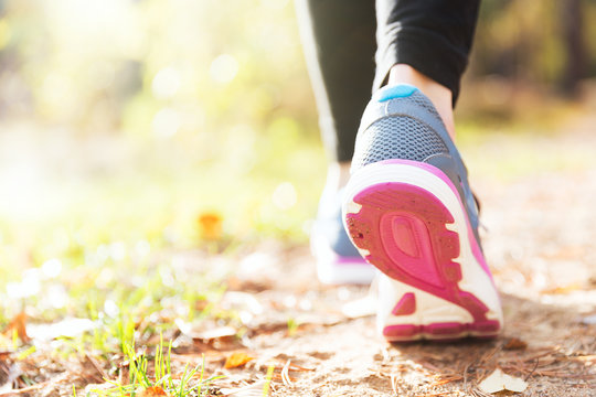 Woman Running Legs In Sunset Forest