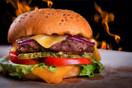 Fresh tasty hot homemade burger with fire