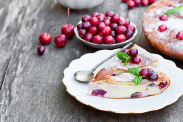 pieces  of cranberry cheesecake tart on a wooden table