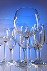 Empty wine glasses on blue background