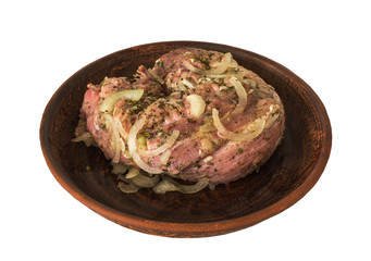 cooking meat. meat marinated with spices on a clay plate clouse-