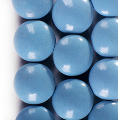 Blue drugs on white background, close up
