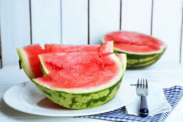 Sliced watermelon on white plate