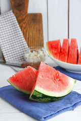 Sliced watermelon on blue cotton napkin