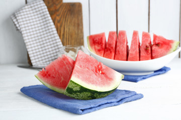 Sliced watermelon on blue cotton napkin