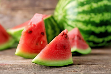 Fresh sliced watermelon wooden background