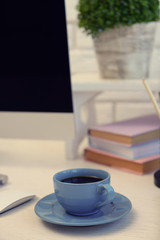 Blue cup of tea on modern table