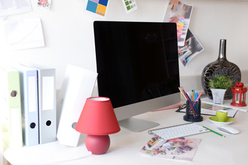 Modern computer on the table in decorated room
