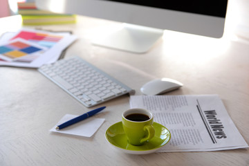 Green cup of coffee on modern table