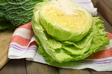 Cut savoy cabbage on wooden cutting board