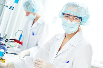 Female scientific researcher making medicine experiment