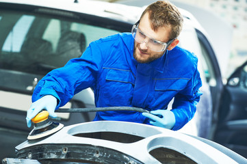 auto mechanic worker polishing bumper car - obrazy, fototapety, plakaty