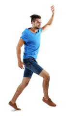 Active guy jumping in joy, isolated on white