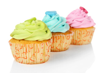 Tasty cupcakes isolated on white background