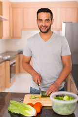 young indian man cooking