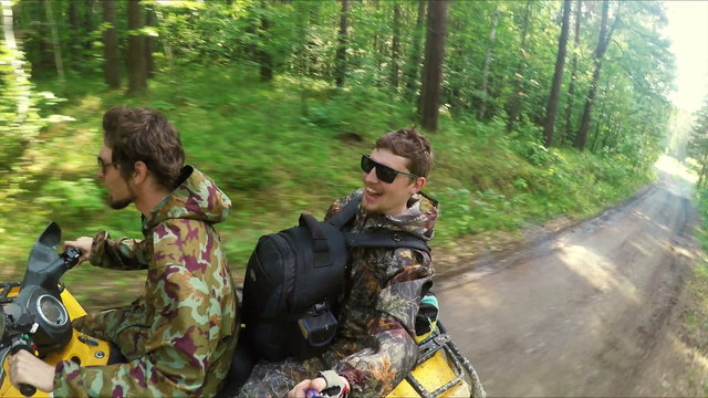 Two Man on ATV in forest video Selfe
