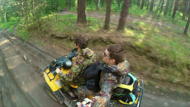 Two Man on ATV in forest video Selfe